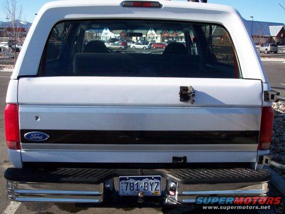 Rear view of a white Ford Bronco with a Colorado license plate 781-BYZ