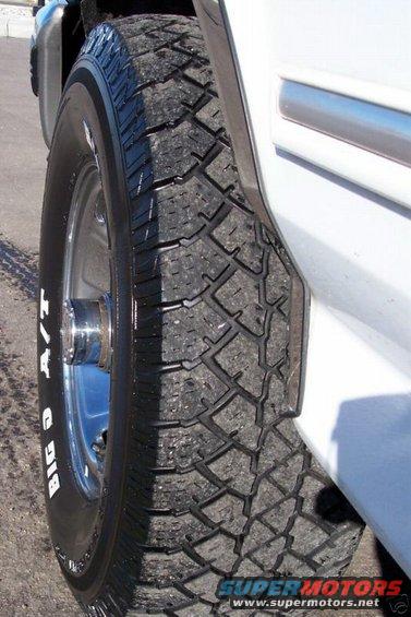 White SUV tire with 'BIG O A/T' text visible