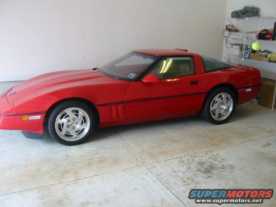 Red Chevrolet Corvette parked in a garage