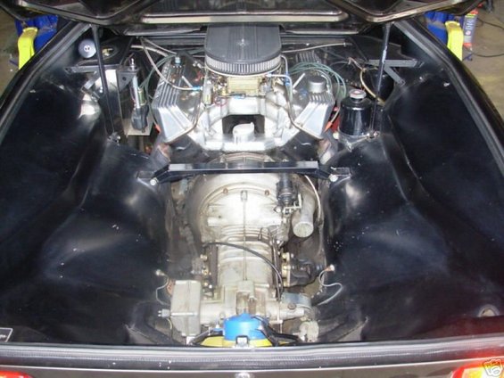 1972 DeTomaso Pantera engine bay with V8 engine, air intake, and transmission visible