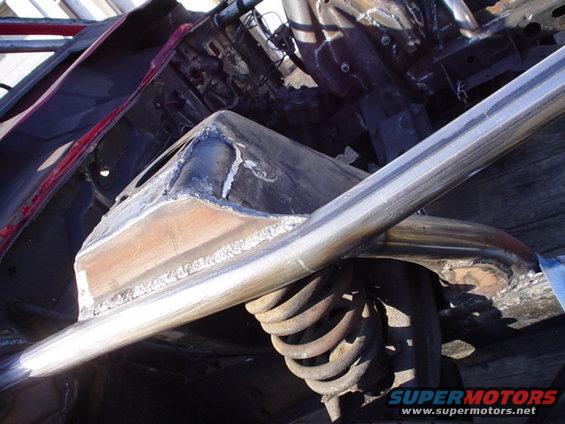 Roll cage and suspension components on a vehicle frame