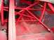 1968 Ford Torino - Close-up view of a red painted metal frame, showing its structural components and connections.