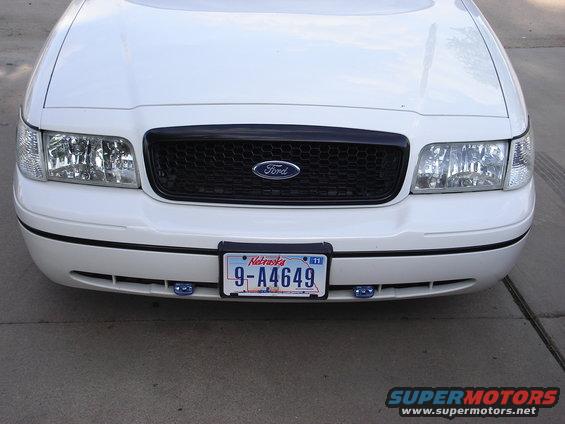 White 2000 Ford Crown Victoria front end with black grille and Nebraska license plate
