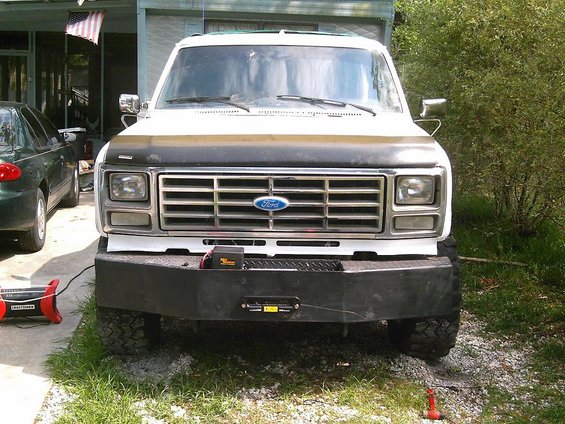 Front view of a 1986 Ford Bronco with a black winch plate bumper and Ford grille