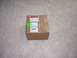 1996 Ford Bronco - A cardboard box sits on a carpeted floor, covered in shipping labels and an invoice sticker.