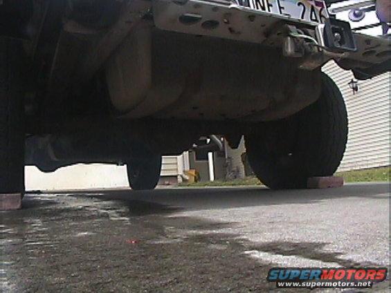 1994 Ford Bronco rear underside with fuel tank and tires on bricks