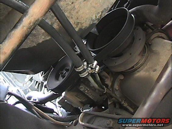 Transmission cooler lines connected to a pulley system