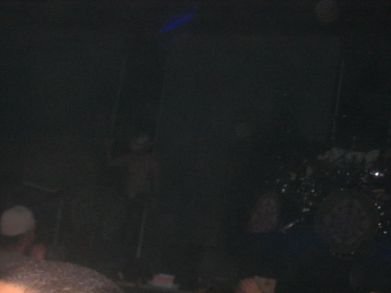 Drum set with cymbals and multiple drums on a dark stage
