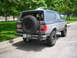 1988 Ford Bronco - This 1988 Ford Bronco features a two-tone paint scheme and a spare tire mounted externally on the rear.