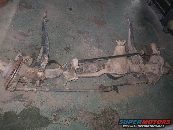 front axle assembly with suspension components and brake rotor