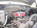 1990 Ford Bronco - The engine bay is dusty, showing various hoses and engine components.