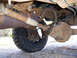 1996 Ford Bronco - Underneath view of a 1996 Ford Bronco's rear axle and suspension components.
