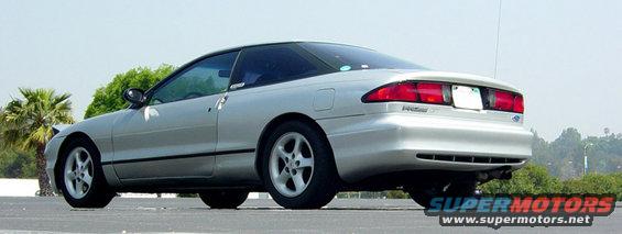 1993 Ford Probe coupe, rear 3/4 view, silver paint