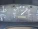 1994 Ford F-150 - Close-up of a vehicle's dashboard, displaying the speedometer, fuel gauge, and temperature gauge.
