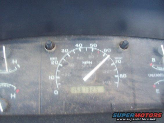 Dashboard gauges with a speedometer reading 50 MPH and an odometer showing 150132.5