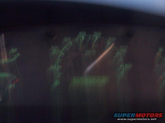 Dashboard gauges showing 70 MPH, with a digital odometer reading 000000