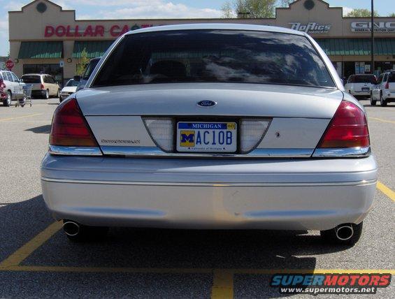 Rear view of silver 2002 Ford Crown Victoria with Michigan plates MAC10B parked in a lot