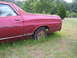 1972 Ford Ranchero - This 1972 Ford Ranchero shows signs of wear and tear, with rust visible on its side panels and rear fender.