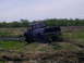 1994 Ford F-250 - Pickup truck stuck in mud during off-road activity.