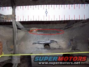 Section of crossmember needing "adjustment" for Marauder pan to fit properly.  Brake line relocated underneath crossmember.