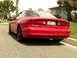 1993 Ford Probe - Rear view of a red 1993 Ford Probe GT parked on a residential street.