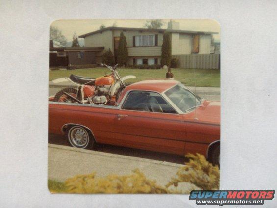 1968 Ford Ranchero parked on street, orange dirt bike loaded in bed