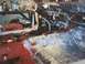 1968 Ford Ranchero - The interior of a vehicle is shown with the dashboard disassembled and sound deadening material being applied to the floor.