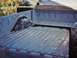1968 Ford Ranchero - The rear of a 1968 Ford Ranchero pickup truck shows its ribbed bed floor and a soft tonneau cover.