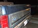 1986 Ford Bronco - Rear view of a 1986 Ford Bronco showing the tailgate and taillight.