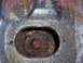 1978 Ford Bronco - Close-up view of a heavily rusted bolt hole, likely from a vehicle's body mount area.