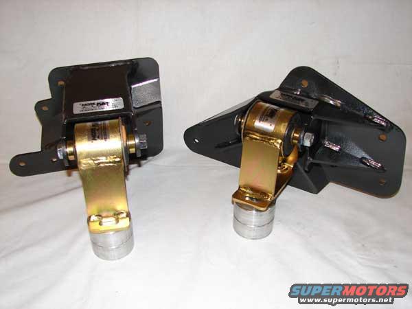 Two black and gold engine mounts on a white background. One mount is on the left, the other on the right