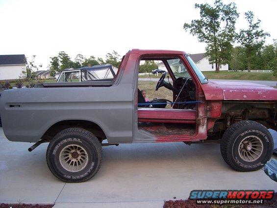1978 Ford Bronco with doors removed, primer on rear quarter panel