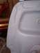 1978 Ford Bronco - Close-up view of a primer-coated fender section, showing its contours and a mounting point.