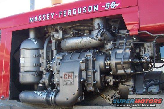 Red Massey-Ferguson tractor engine with GM components and air filter