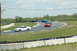 1993 Ford Mustang - Multiple cars race on a track, with a white Mustang in the foreground.