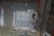 1994 Ford Bronco - Undercarriage repair work is visible, with patched metal and exposed wiring on the vehicle's frame.