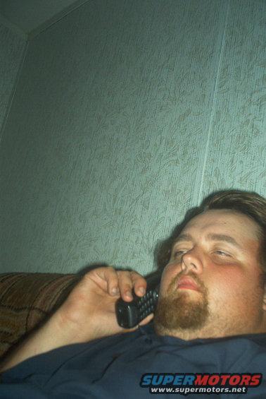 Man on phone, interior scene