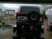1986 Ford Bronco - This 1986 Ford Bronco is seen from the rear, its iconic spare tire mount and two-tone paint scheme.