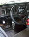 1979 Ford Bronco - Interior view of a 1979 Ford Bronco, the dashboard, steering wheel, and pedals.