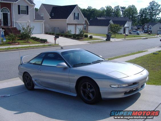 1994 Ford Probe coupe parked in driveway, front quarter view