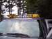 2002 Chevrolet Suburban - Vehicle roof with an emergency light bar, seen from the front windshield.