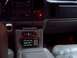 2002 Chevrolet Suburban - The dashboard of a vehicle features several electronic devices, including radios and a communication unit.