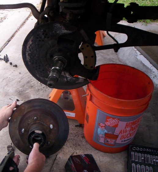 Once you remove the Rotor, you will be ready to take off the 6 nuts for the Spindle. 