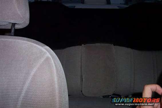 back_seat.jpg New (old?) rear seat, custom painted, with folding armrest and elevated headrests.