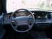 1996 Ford Crown Victoria - The dashboard and steering wheel of a 1996 Ford Crown Victoria are visible in this interior shot.