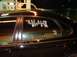 2000 Ford Taurus - Numbers 4648 and 3 are written on the side window of a black car.