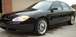 2000 Ford Taurus - This black 2000 Ford Taurus sedan features custom chrome rims and a clean exterior.