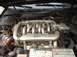 2000 Ford Taurus - Close-up of a Ford SHO V6 engine, showing the intake manifold and battery.