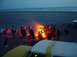 1996 Ford Bronco - Bonfire on the beach with people and vehicles.