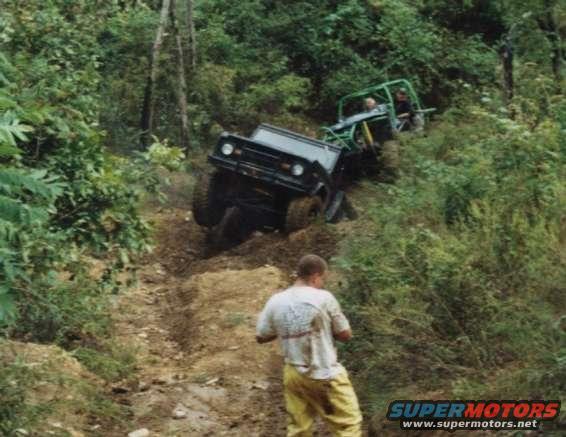 doc_twisting.jpg Doc being twisted by Twister 3.  Slim looks on with his 4wheeler paper pants.